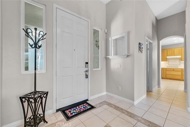 entryway featuring light tile patterned flooring