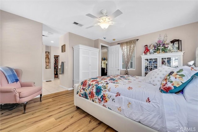 bedroom featuring light hardwood / wood-style floors and ceiling fan