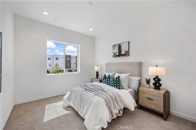 bedroom with light colored carpet