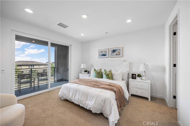 bedroom with light colored carpet and access to exterior