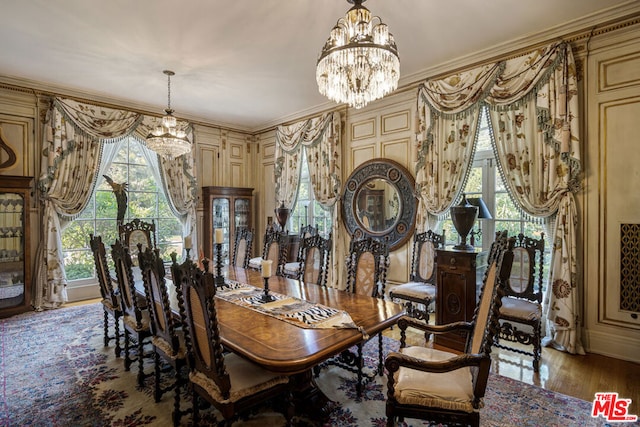 dining area featuring light hardwood / wood-style floors, plenty of natural light, and a notable chandelier