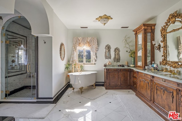 bathroom featuring vanity and plus walk in shower