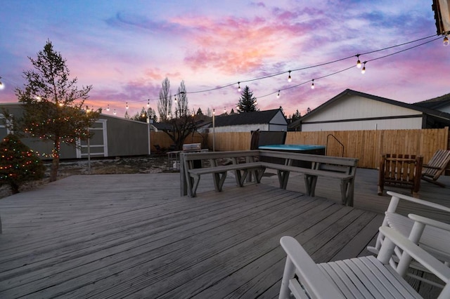 deck at dusk with a storage shed