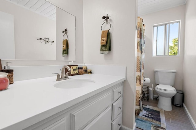 bathroom featuring toilet, hardwood / wood-style flooring, and vanity