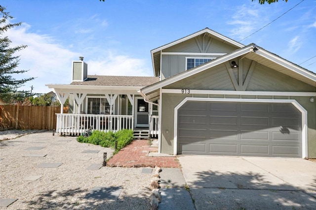 view of front facade featuring a porch and a garage