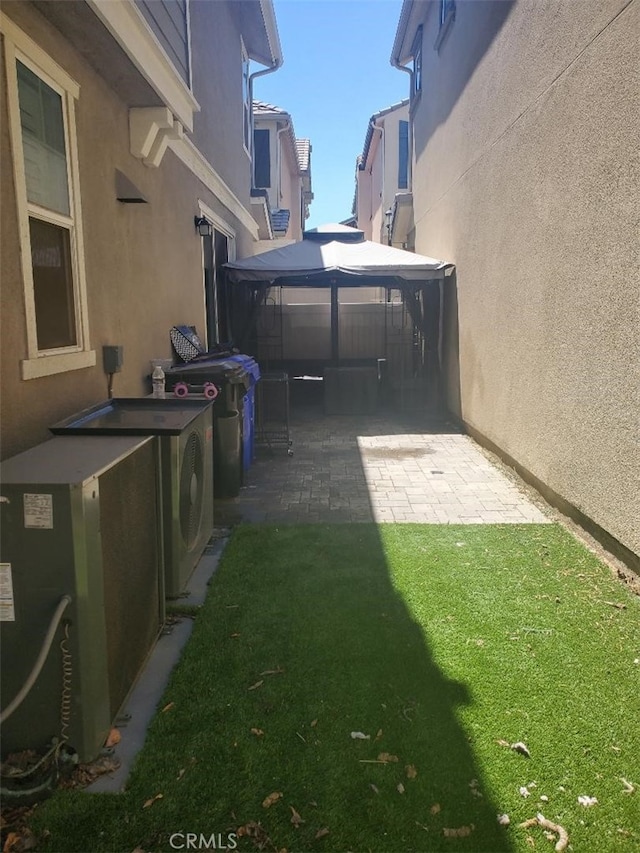 view of yard featuring a gazebo and a patio