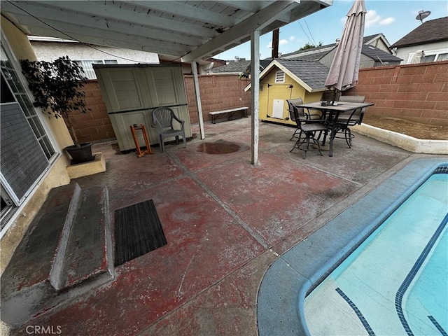 view of patio / terrace with a fenced in pool