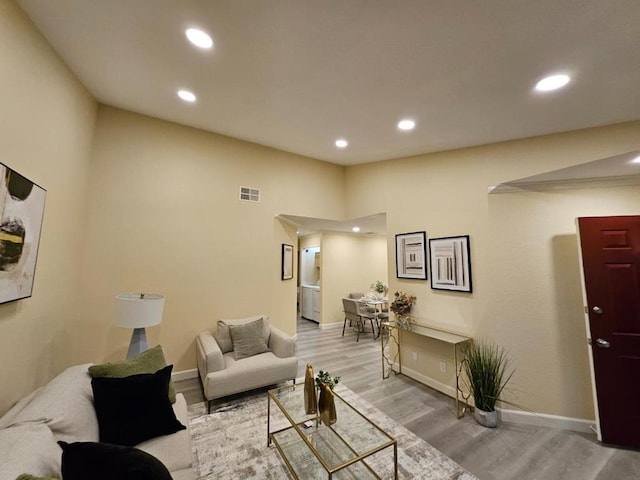 living room with light hardwood / wood-style floors