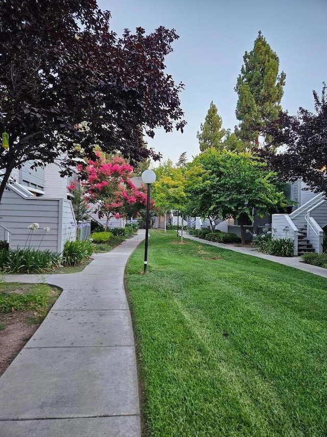 view of home's community with a lawn