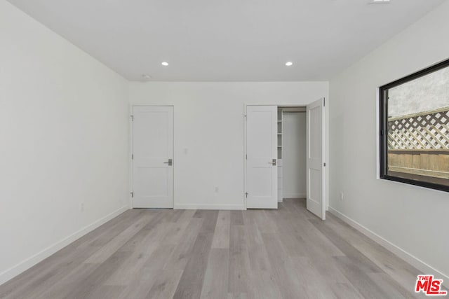 unfurnished bedroom featuring light hardwood / wood-style flooring