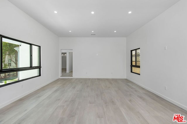 spare room with light wood-type flooring