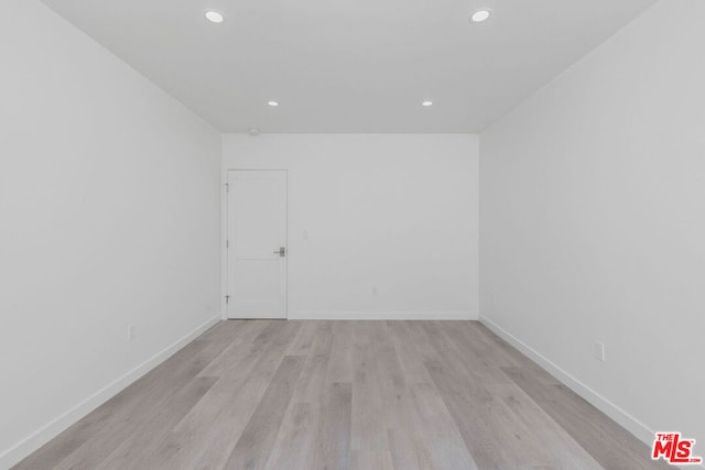 unfurnished room featuring light hardwood / wood-style floors