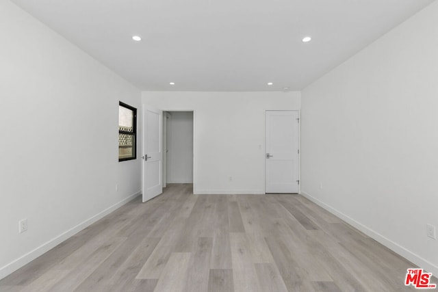 empty room with light wood-type flooring