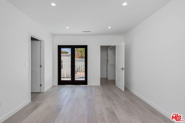 foyer with french doors and light wood-type flooring