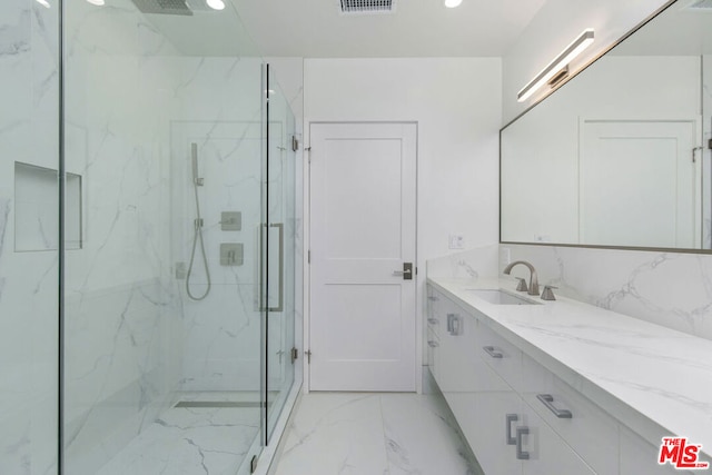 bathroom with vanity and walk in shower