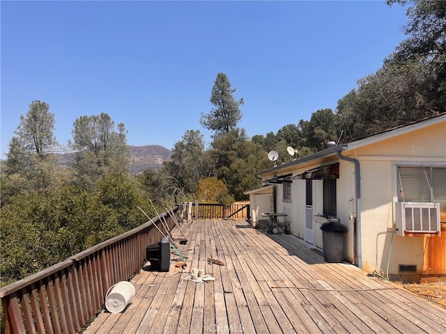 wooden terrace featuring cooling unit and a mountain view