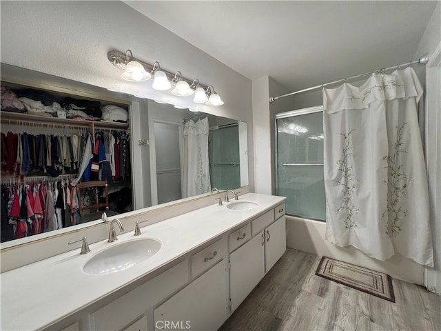 bathroom with vanity, shower / bath combo, and hardwood / wood-style flooring