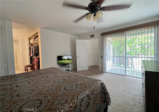 bedroom with a closet, ceiling fan, light carpet, and access to exterior