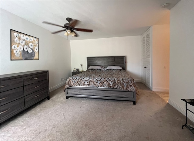 carpeted bedroom with a closet and ceiling fan