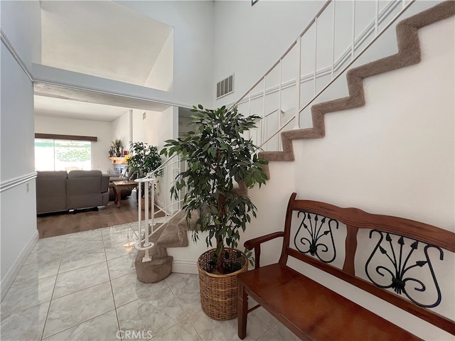 staircase featuring wood-type flooring