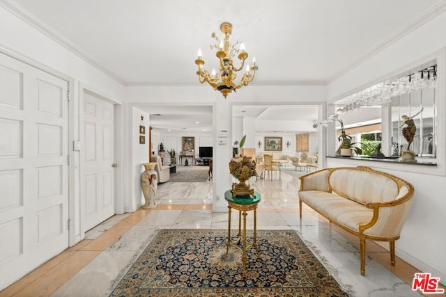 entryway featuring crown molding and a chandelier