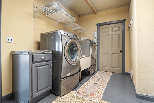 laundry room with washer and clothes dryer