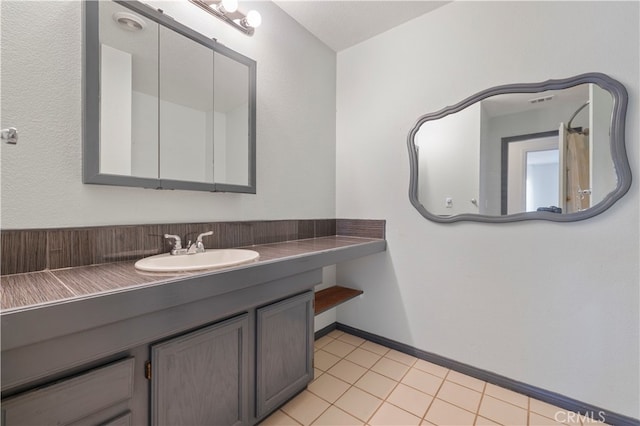 bathroom with vanity and tile patterned flooring