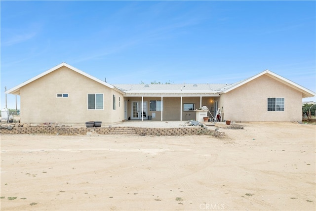 rear view of property with a patio