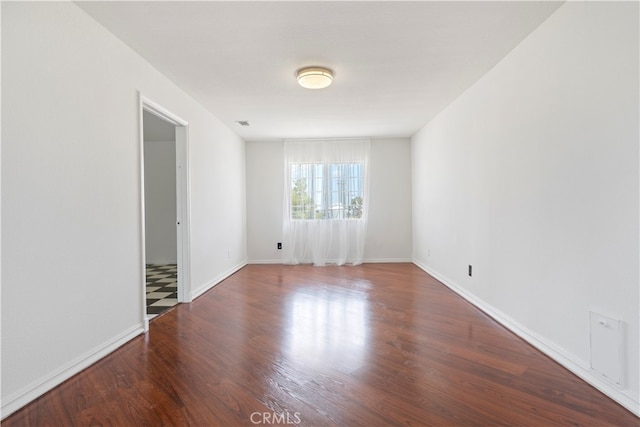 spare room with hardwood / wood-style floors