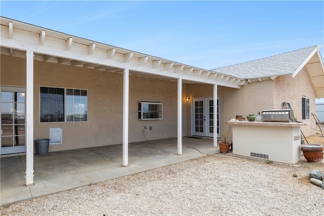 back of property with a patio area