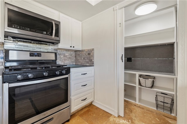 kitchen featuring appliances with stainless steel finishes, tasteful backsplash, and white cabinets