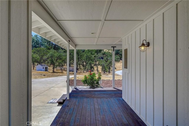 wooden deck with a patio