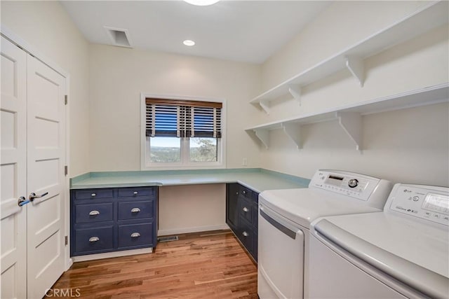 laundry room featuring visible vents, cabinet space, separate washer and dryer, recessed lighting, and light wood-style flooring