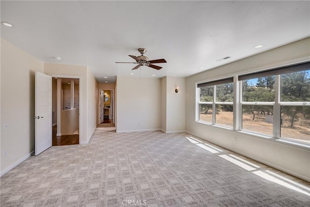 unfurnished room featuring visible vents, a ceiling fan, recessed lighting, and light carpet