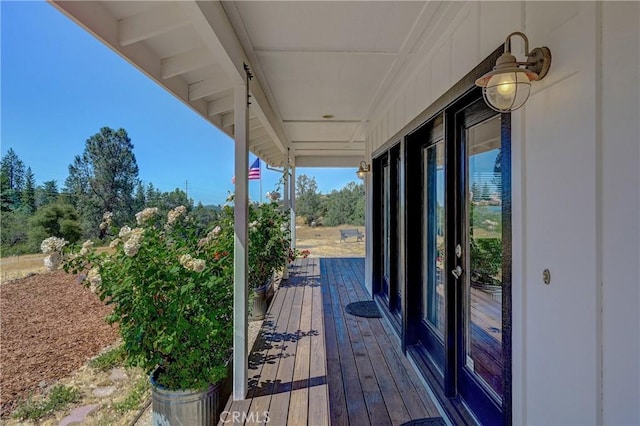 wooden terrace with a porch