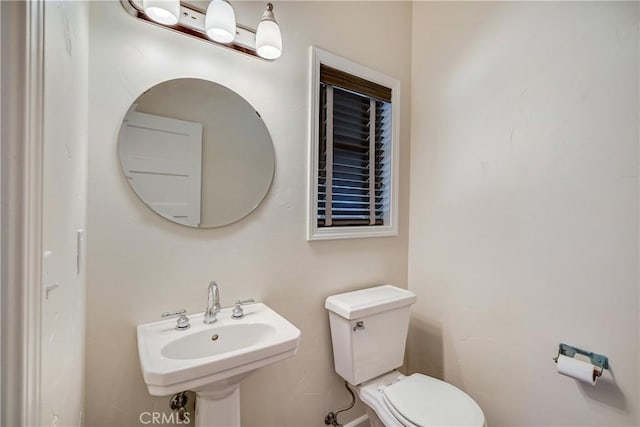 bathroom with a sink and toilet