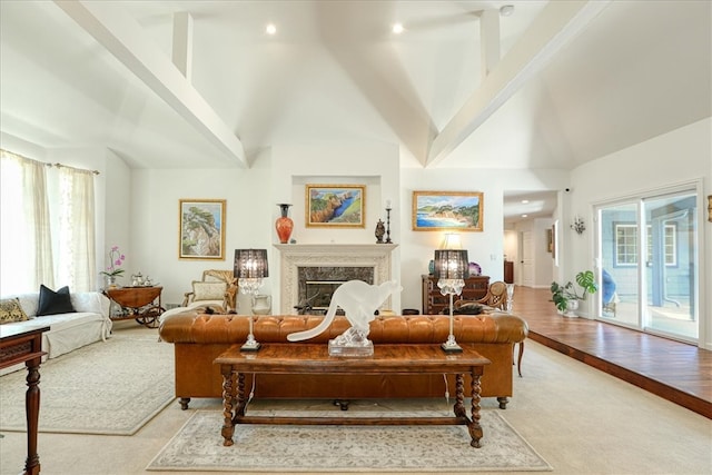 living room with a towering ceiling and a premium fireplace