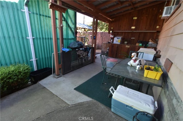 view of patio featuring fence, visible vents, and outdoor dining space