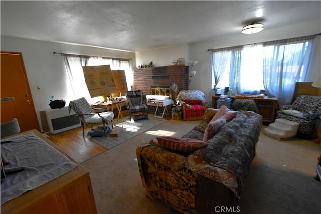 carpeted living area featuring a fireplace