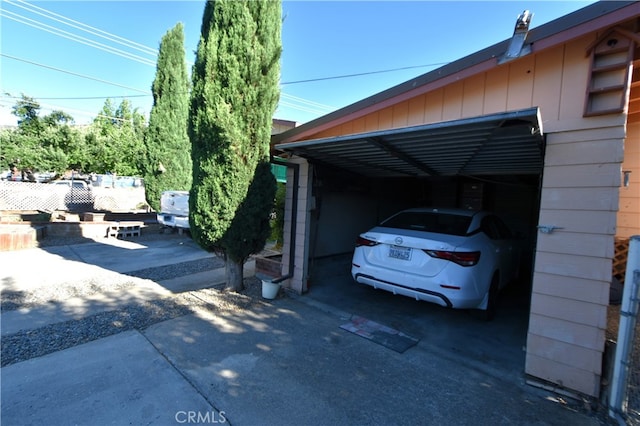 view of parking / parking lot featuring a carport