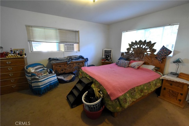 bedroom featuring cooling unit and carpet floors