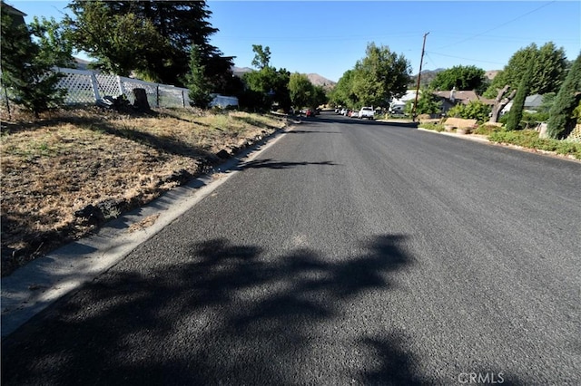 view of road with curbs