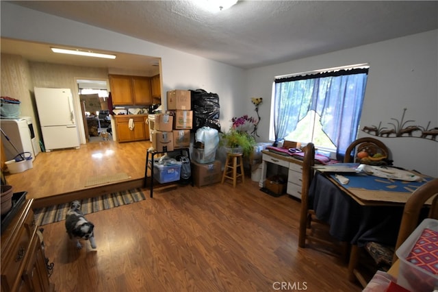 office space with a textured ceiling and hardwood / wood-style floors