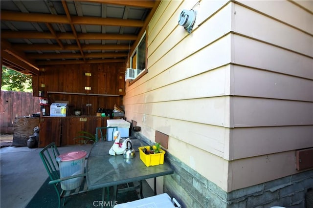 view of patio / terrace with outdoor dining space and fence