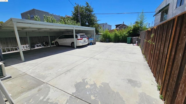 view of parking / parking lot with a carport