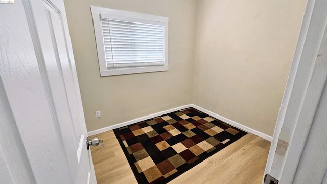 spare room with hardwood / wood-style floors