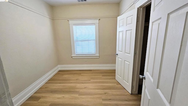 hall with light hardwood / wood-style floors