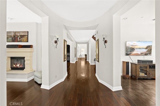 hall with dark hardwood / wood-style floors