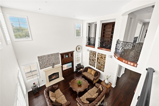 living room with dark hardwood / wood-style floors