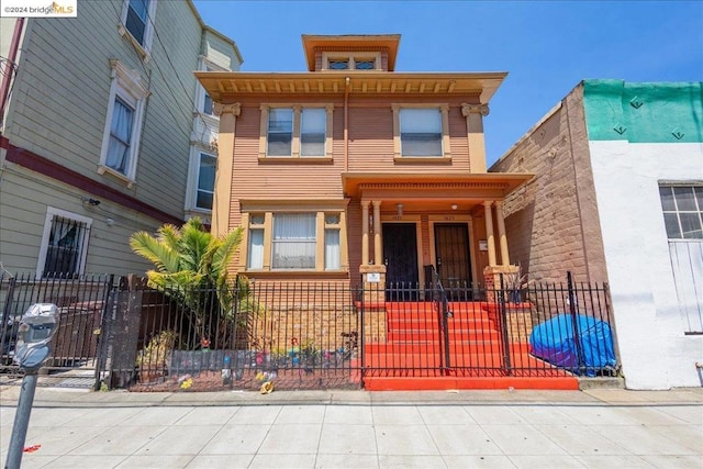 italianate home featuring a porch